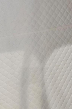 Cream quilted diamond-pattern leather interior lining option for the XLS34D-Mini hyperbaric chamber