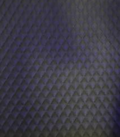 Dark charcoal gray quilted diamond-pattern leather interior lining option for the XLS34D-Mini hyperbaric chamber
